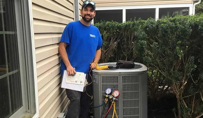 A professional inspecting AC