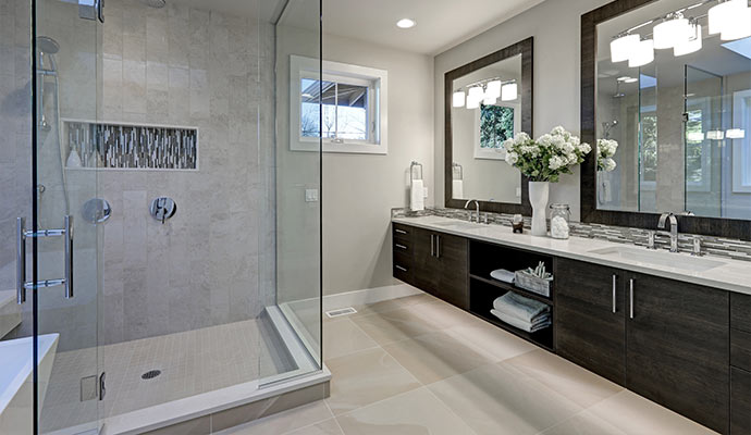 Modern bathroom with glass shower and double sink vanity