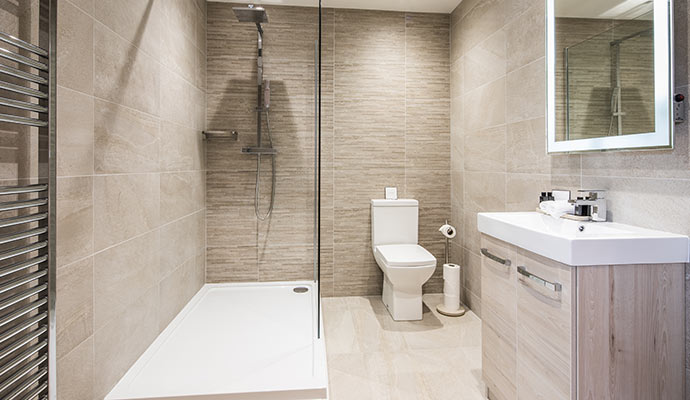 Contemporary bathroom layout with walk-in shower and toilet fixture