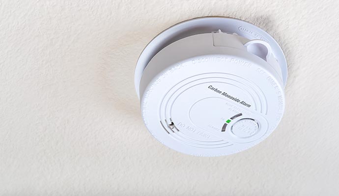 Carbon monoxide alarm mounted on ceiling.