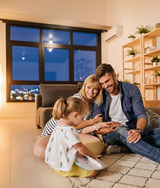 Happy family enjoying comfortable indoor home temperature.