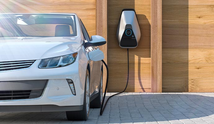 A modern residential 120-volt electric vehicle charging station in use
