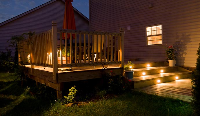 Outdoor deck and stair with installed lighting.