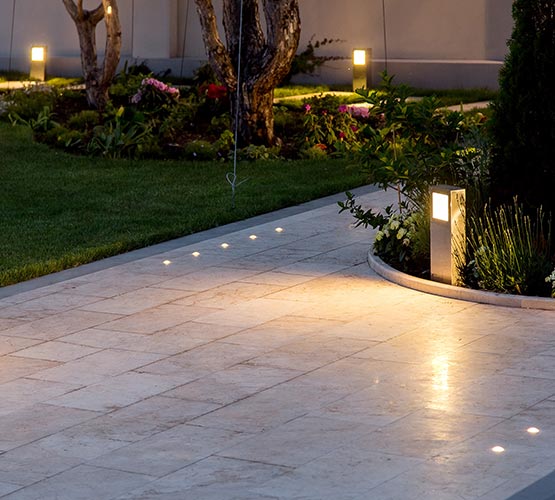 Outdoor pathway garden with installed lighting.