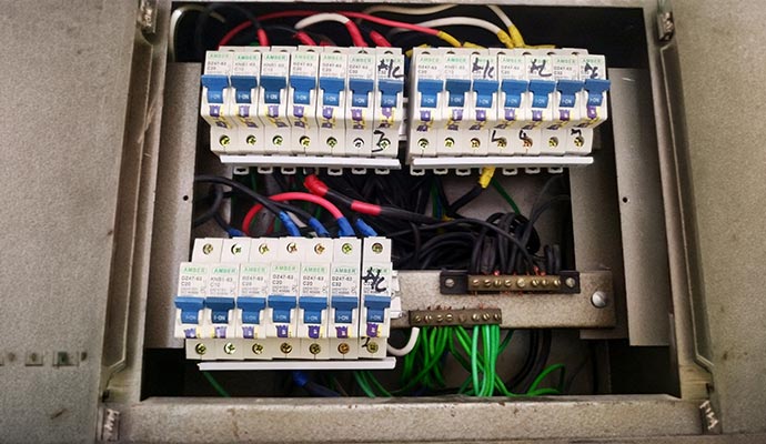 Detailed internal wiring of a residential circuit breaker panel.