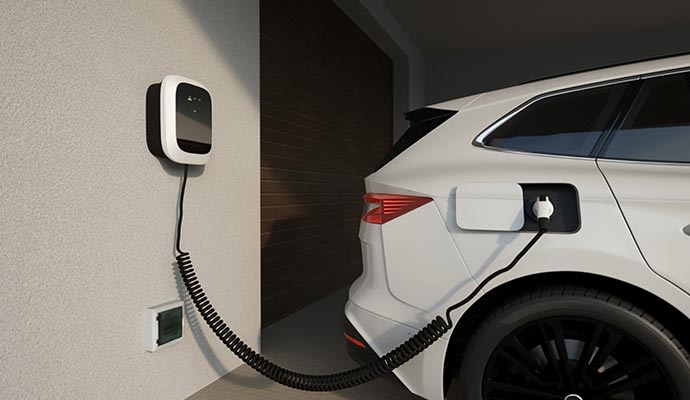 Wall-mounted EV charger supplying power to a electric car.