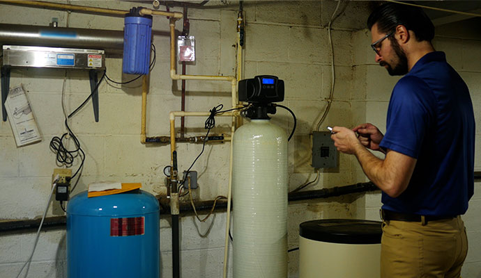 Technician inspecting a water treatment system