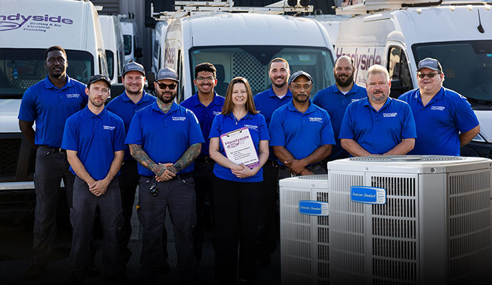Handyside HVAC service team with American Standard units and service vans