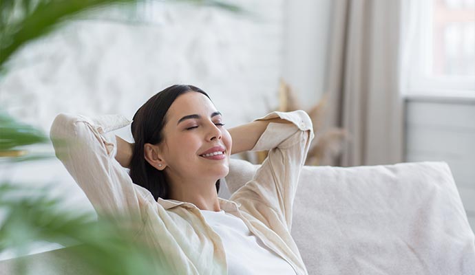 Woman relaxing in a fresh indoor air environment