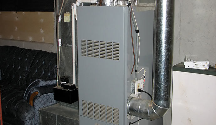 Installed residential oil furnace unit in basement