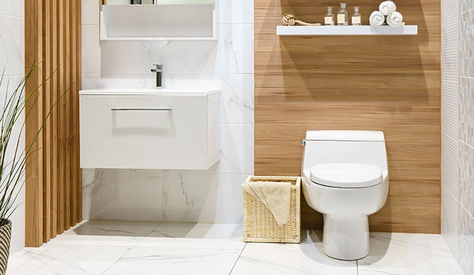 Modern bathroom interior with white toilet and floating vanity