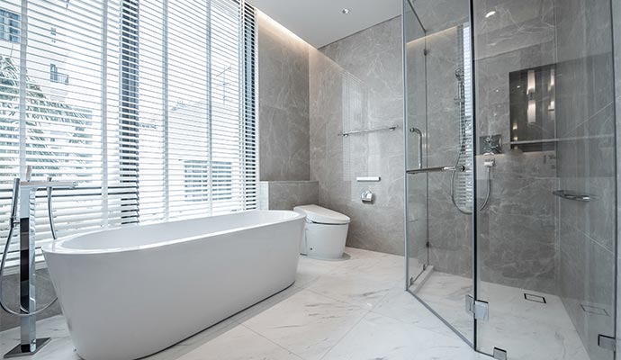 Modern luxury remodeled bathroom with bathtub and toilet