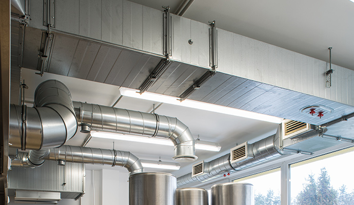 Newly installed duct work along the ceiling in a commercial facility