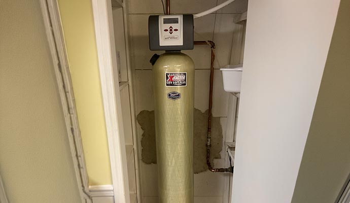 Installed water softener system.