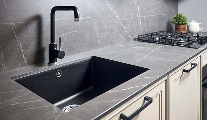 Modern black kitchen faucet installation.