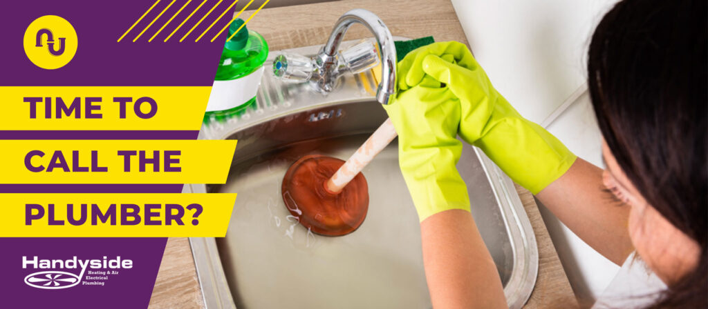 Professional plumber using plunger to clear a clogged sink.