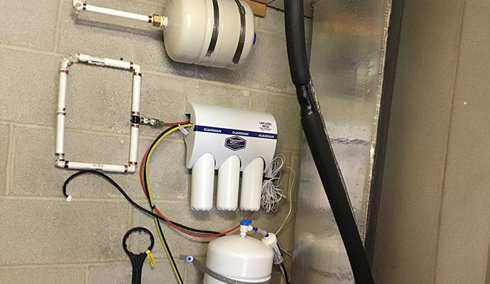 Reverse osmosis water filtration system installation.