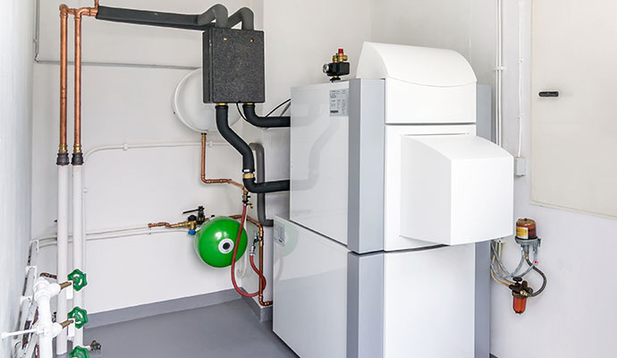 Residential oil boiler system with expansion tank in a basement